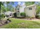 An expansive backyard features a well-maintained lawn and detailed landscaping surrounding a classic two-story home at 12328 Chickasaw Dr, Huntersville, NC 28078