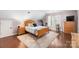 Bedroom featuring a double bed, hardwood floors, and natural light at 12328 Chickasaw Dr, Huntersville, NC 28078