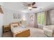 bedroom featuring a single bed, daisy wallpaper and bright natural light at 12328 Chickasaw Dr, Huntersville, NC 28078