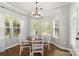 Bright breakfast nook with bay window and charming chandelier at 12328 Chickasaw Dr, Huntersville, NC 28078