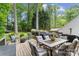 A spacious deck includes comfortable seating and a grill, perfect for outdoor entertaining and relaxation at 12328 Chickasaw Dr, Huntersville, NC 28078