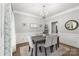 Elegant dining room with wainscoting, chandelier, and hardwood floors at 12328 Chickasaw Dr, Huntersville, NC 28078