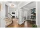 Inviting foyer with hardwood floors, staircase, and access to living spaces at 12328 Chickasaw Dr, Huntersville, NC 28078