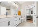 Bright bathroom featuring a double vanity with sleek fixtures, a large mirror, and modern lighting at 12705 Twilight Dr, Mint Hill, NC 28227