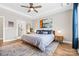 Bright bedroom with hardwood floors, a large bed, bedside tables, and a neutral color scheme at 12705 Twilight Dr, Mint Hill, NC 28227