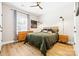 Inviting bedroom with hardwood floors, a queen-size bed, and modern lighting at 12705 Twilight Dr, Mint Hill, NC 28227
