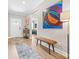 Bright entryway featuring wood floors, neutral walls, artwork, and bench at 12705 Twilight Dr, Mint Hill, NC 28227