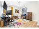 Spacious home office with large desk, ample storage, and vibrant rug creating an inspiring workspace at 12705 Twilight Dr, Mint Hill, NC 28227