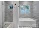 Contemporary bathroom featuring a separate shower and bathtub with large windows at 1517 Parkwood Ave, Charlotte, NC 28205