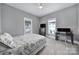 Bedroom with neutral carpet, good natural light, a ceiling fan, and a dedicated desk space at 1517 Parkwood Ave, Charlotte, NC 28205