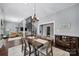 Bright dining room featuring a chandelier, spiral staircase, and hardwood floors at 1517 Parkwood Ave, Charlotte, NC 28205