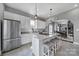 Modern kitchen features white cabinets, granite countertops, and stainless steel appliances at 1517 Parkwood Ave, Charlotte, NC 28205