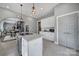 Open kitchen features a center island, white cabinets, and modern appliances at 1517 Parkwood Ave, Charlotte, NC 28205