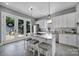 Bright kitchen with granite countertops, stainless steel appliances, and convenient island seating at 1517 Parkwood Ave, Charlotte, NC 28205