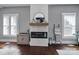 Elegant living room featuring a modern fireplace, built-in shelving, and stylish decor at 1517 Parkwood Ave, Charlotte, NC 28205