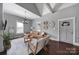 Bright living room with vaulted ceilings, a stylish chandelier, and comfortable seating at 1517 Parkwood Ave, Charlotte, NC 28205