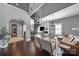 Spacious living room features a spiral staircase, hardwood floors, and a cozy fireplace at 1517 Parkwood Ave, Charlotte, NC 28205