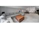 Bright living room showcasing a sectional sofa, leather ottoman, and open layout to second-floor space at 1517 Parkwood Ave, Charlotte, NC 28205
