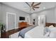 Spacious main bedroom with hardwood floors, ceiling fan and ensuite access at 1517 Parkwood Ave, Charlotte, NC 28205