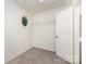 Walk-in closet with a carpeted floor, wire shelving, and a uniquely shaped window at 1620 Crandon Dr, Charlotte, NC 28216