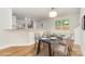 Open dining area featuring a modern table with seating for four and bright lighting at 1620 Crandon Dr, Charlotte, NC 28216