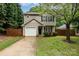 Charming two-story home with a one-car garage and well-maintained lawn at 1620 Crandon Dr, Charlotte, NC 28216