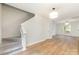Open floor plan with staircase, neutral walls, and hardwood floors at 1620 Crandon Dr, Charlotte, NC 28216