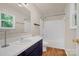 Clean bathroom featuring a shower, sink, vanity, and a window at 177 Candlestick Dr, Statesville, NC 28625