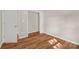 Bedroom view showcasing closet, wood flooring, and neutral walls at 177 Candlestick Dr, Statesville, NC 28625