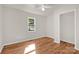 Cozy bedroom featuring wood flooring, natural light, and a ceiling fan at 177 Candlestick Dr, Statesville, NC 28625