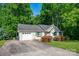 Ranch home featuring an attached garage and a spacious concrete driveway at 177 Candlestick Dr, Statesville, NC 28625
