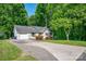 Charming home with well-maintained landscaping and a large driveway at 177 Candlestick Dr, Statesville, NC 28625