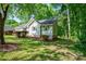 Exterior single story house with greenery, mulch and landscaped yard at 177 Candlestick Dr, Statesville, NC 28625