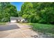 Spacious front yard featuring a single Gathering home with an attached garage and concrete driveway at 177 Candlestick Dr, Statesville, NC 28625