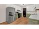 Spacious kitchen with stainless steel refrigerator, oven, and plentiful cabinet storage at 177 Candlestick Dr, Statesville, NC 28625