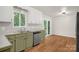 Cozy kitchen boasts light cabinets, wood-look flooring, and stainless-steel appliances at 177 Candlestick Dr, Statesville, NC 28625