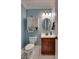 Charming bathroom with blue walls, white fixtures, and a decorative mirror at 181 Edgewater Rd, Hickory, NC 28601