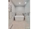 Contemporary bathroom with a freestanding tub, tiled accent wall, and glass-enclosed shower at 181 Edgewater Rd, Hickory, NC 28601
