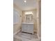 Bathroom featuring a vanity with marble countertops, a framed mirror, and modern fixtures at 181 Edgewater Rd, Hickory, NC 28601