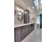 Modern bathroom featuring dual sinks, stylish mirrors, and gray cabinets for ample storage at 181 Edgewater Rd, Hickory, NC 28601