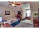 Cozy bedroom with a ceiling fan, dresser, TV, and natural light from the window at 181 Edgewater Rd, Hickory, NC 28601
