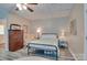 Comfortable bedroom with an iron bed frame, ceiling fan, and carpet at 181 Edgewater Rd, Hickory, NC 28601