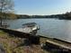 Picturesque view of a private boat dock on the tranquil lake, promising endless water adventures at 181 Edgewater Rd, Hickory, NC 28601