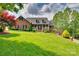 Stately brick home with a charming front porch and meticulously maintained lawn at 181 Edgewater Rd, Hickory, NC 28601