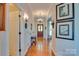 Elegant hallway with hardwood floors, decorative lighting, and a view of the front door at 181 Edgewater Rd, Hickory, NC 28601