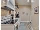 Charming kitchen features white cabinetry, granite countertops, and stainless steel appliances at 181 Edgewater Rd, Hickory, NC 28601
