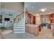 Open-concept kitchen with stainless steel appliances, a granite island, and tile flooring at 181 Edgewater Rd, Hickory, NC 28601