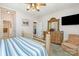 Inviting bedroom with a comfortable bed, a cozy armchair, and ample closet space, enhanced by a mounted television at 182 Meek Rd, Gastonia, NC 28056