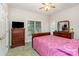 Bedroom with a light-colored walls and carpet, a wooden bed frame, and a dresser beneath a window at 182 Meek Rd, Gastonia, NC 28056
