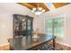 Bright dining area with decorative cabinet, chandelier lighting and large windows overlooking the exterior at 182 Meek Rd, Gastonia, NC 28056